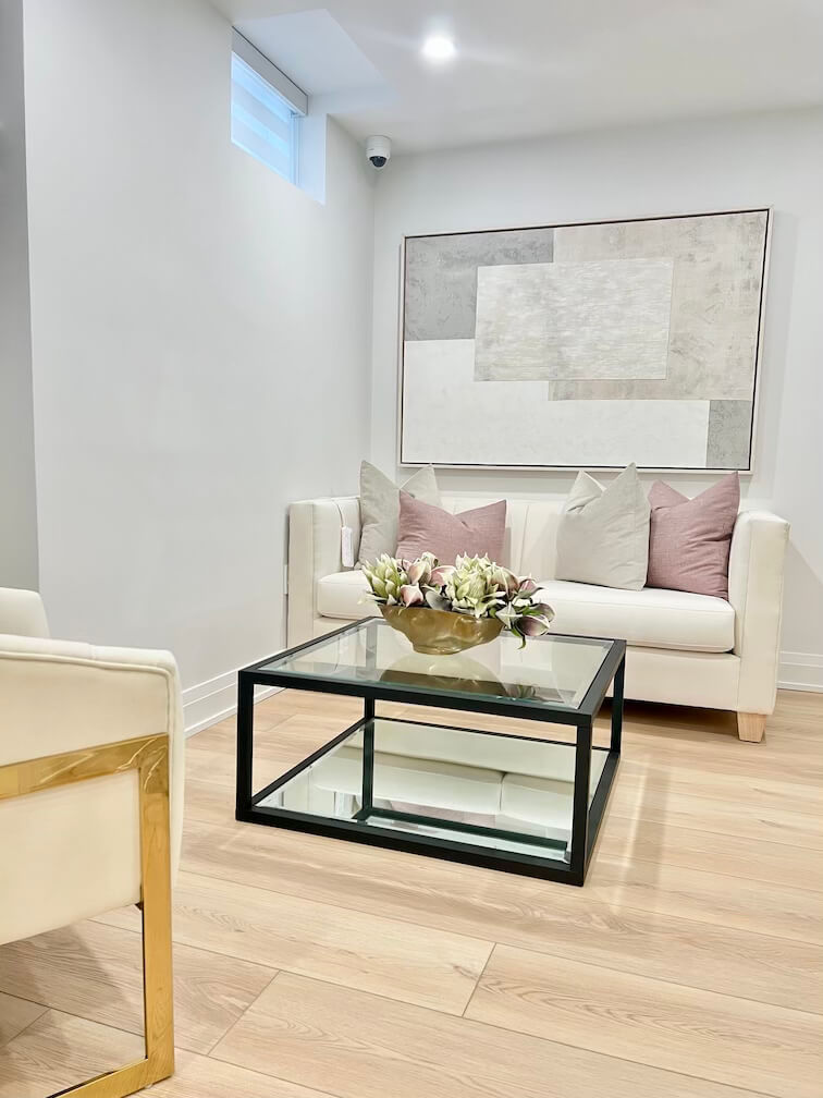 Cozy waiting area with pink aesthetic at a top-rated Pickering lash and brow studio.