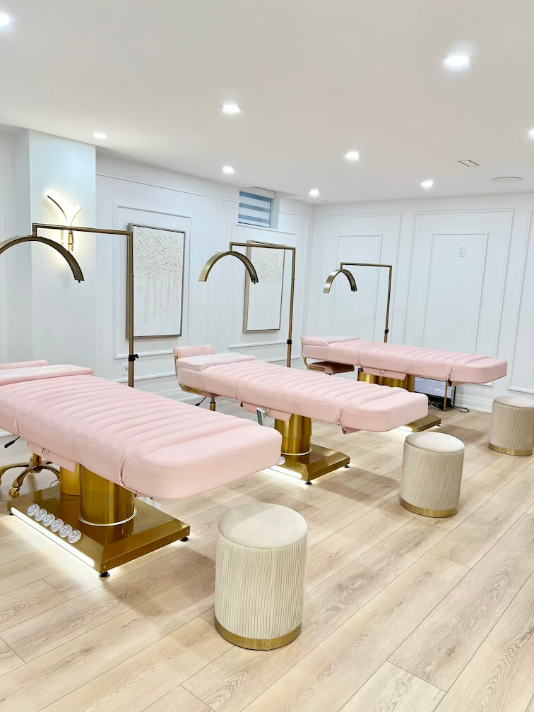 Soft pink and white salon décor for a relaxing beauty experience in Pickering.